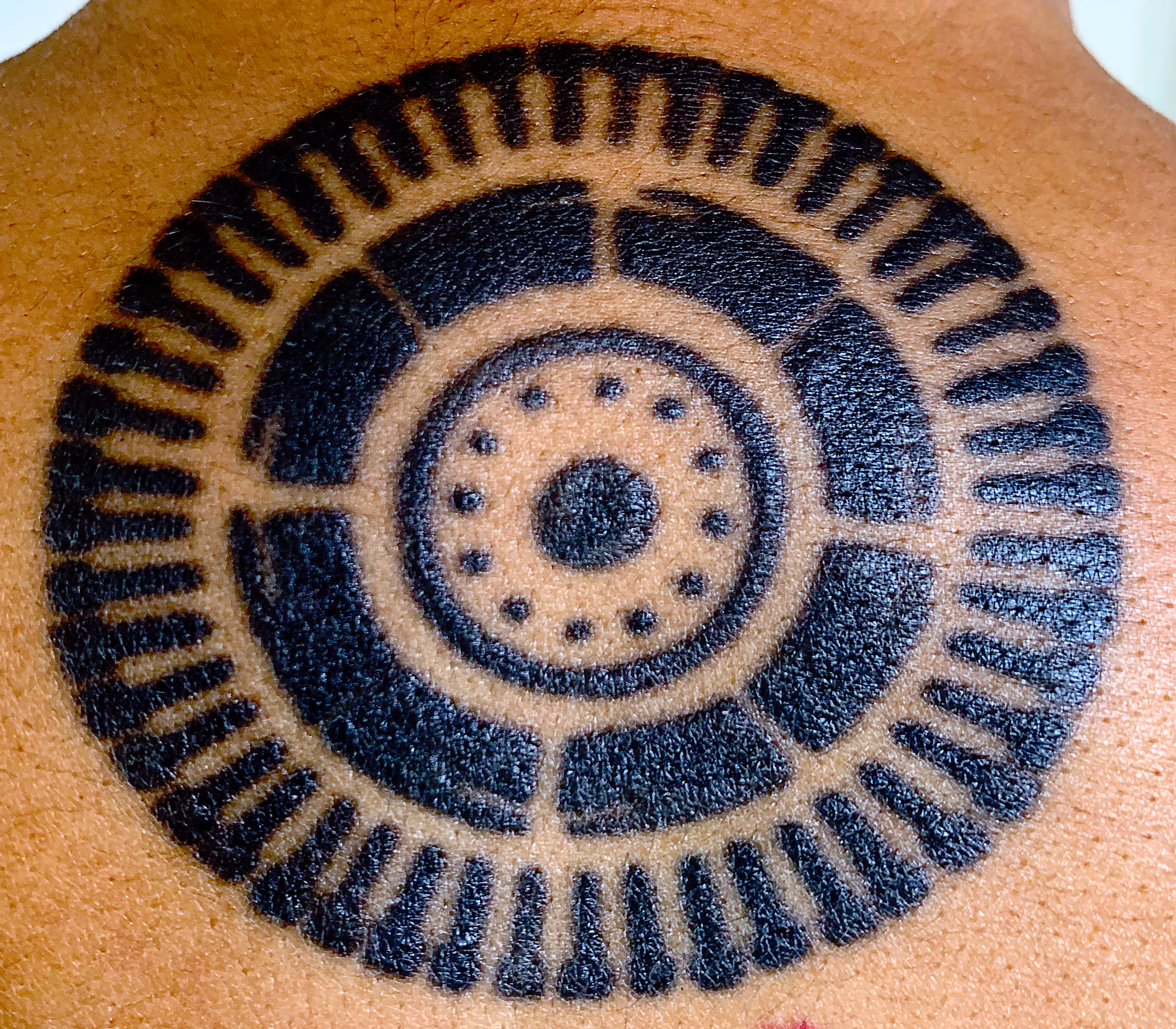 Black ink panopticon tattoo.